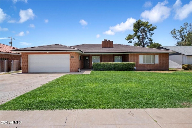 ranch-style house with a front lawn and a garage