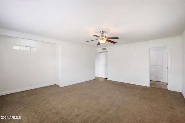 unfurnished room with carpet floors and ceiling fan