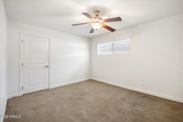 unfurnished room featuring ceiling fan and light colored carpet