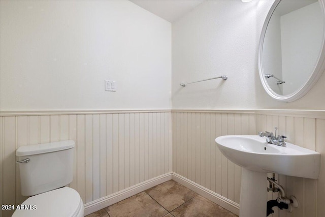 bathroom featuring toilet and tile patterned floors