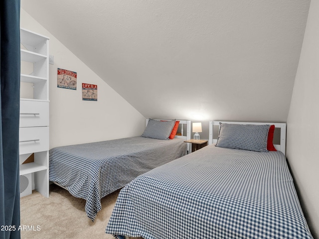 carpeted bedroom with vaulted ceiling