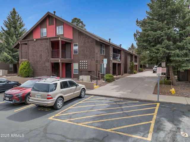 view of property with uncovered parking