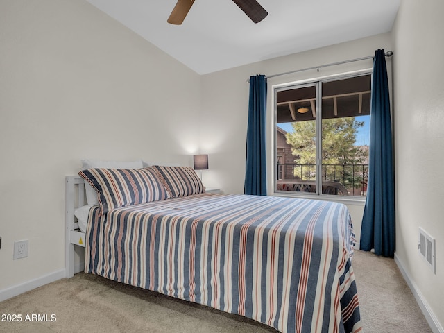 carpeted bedroom featuring baseboards, a ceiling fan, and visible vents