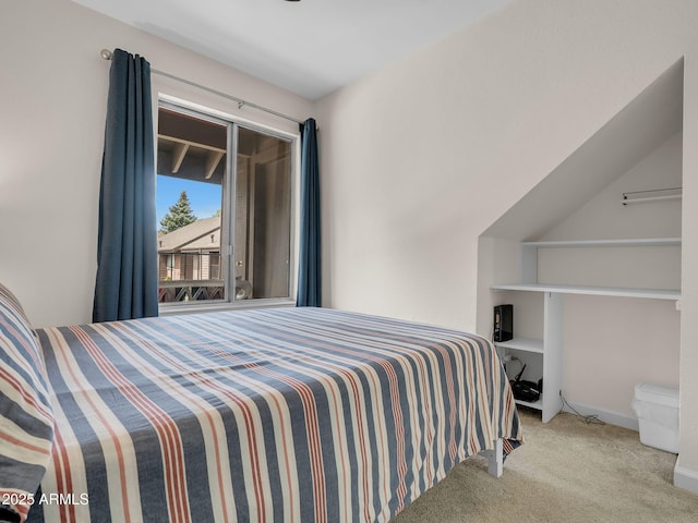 bedroom with carpet floors and baseboards