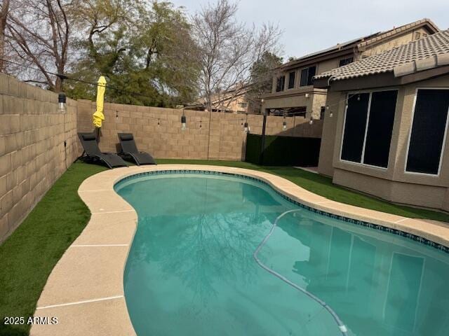 view of swimming pool featuring a fenced in pool and a fenced backyard