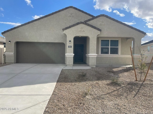 653 W Freedom St, Florence, AZ 85132 - view of front of property with stucco siding, a garage, and driveway