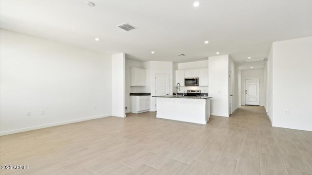 653 W Freedom St, Florence, AZ 85132 - unfurnished living room with recessed lighting and light wood-style flooring