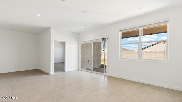 653 W Freedom St, Florence, AZ 85132 - spare room with baseboards and recessed lighting