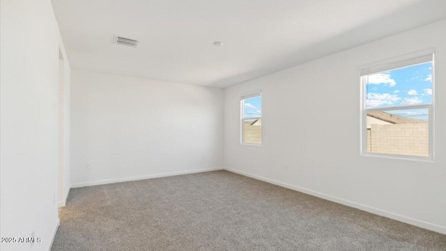 653 W Freedom St, Florence, AZ 85132 - carpeted spare room with baseboards