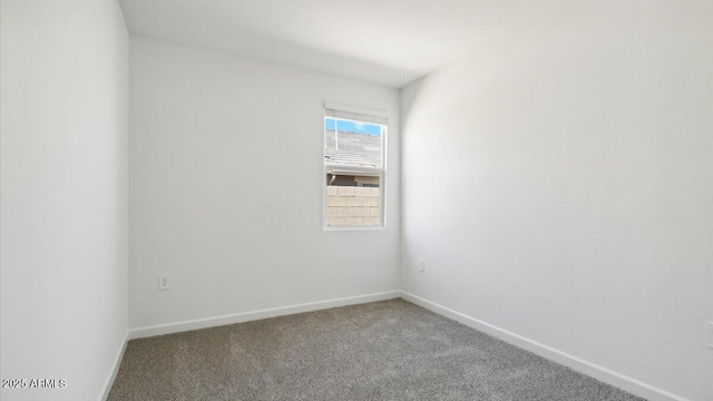 653 W Freedom St, Florence, AZ 85132 - carpeted spare room featuring baseboards