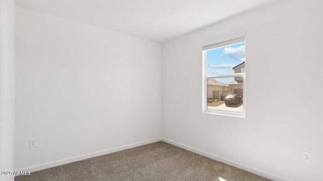 653 W Freedom St, Florence, AZ 85132 - carpeted empty room featuring baseboards
