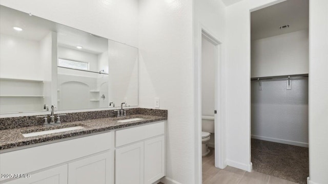 653 W Freedom St, Florence, AZ 85132 - full bath with double vanity, a spacious closet, and a shower
