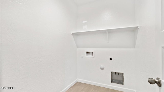 653 W Freedom St, Florence, AZ 85132 - laundry area with washer hookup, light wood finished floors, electric dryer hookup, and gas dryer hookup
