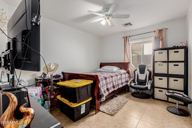 bedroom with tile patterned floors and a ceiling fan