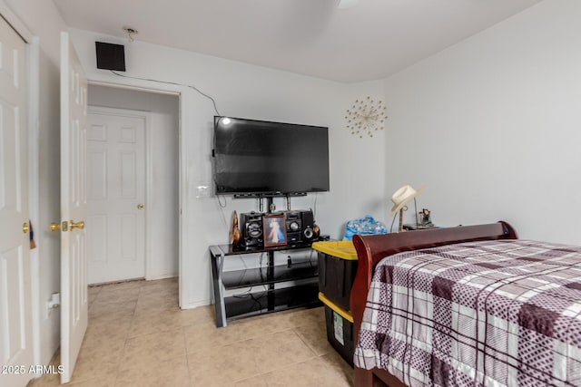 bedroom with light tile patterned floors