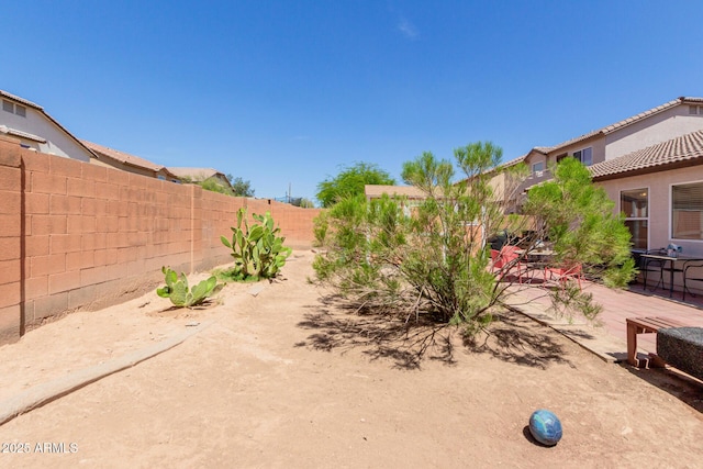 fenced backyard featuring a patio