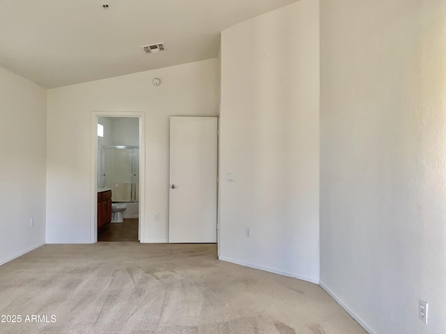 2402 E 5th St Unit 1472, Tempe, AZ 85288 - unfurnished room featuring vaulted ceiling and light colored carpet