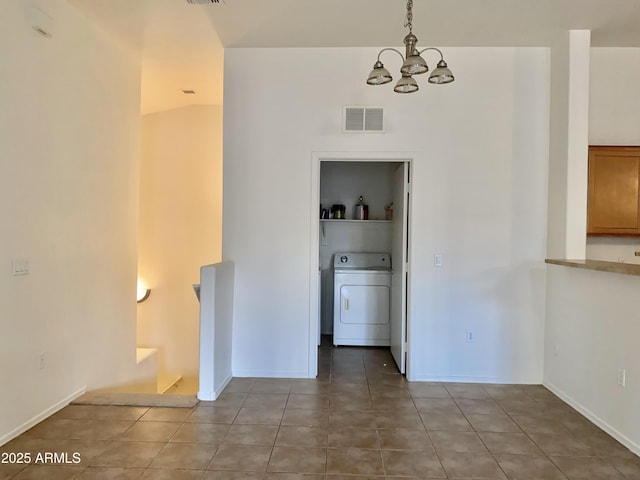 2402 E 5th St Unit 1472, Tempe, AZ 85288 - unfurnished dining area with washer / clothes dryer, a chandelier, and light tile patterned floors