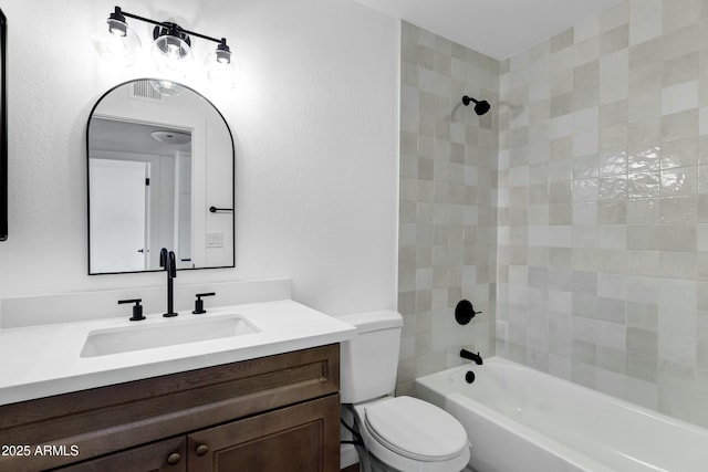 full bathroom with visible vents, vanity, bathtub / shower combination, and toilet