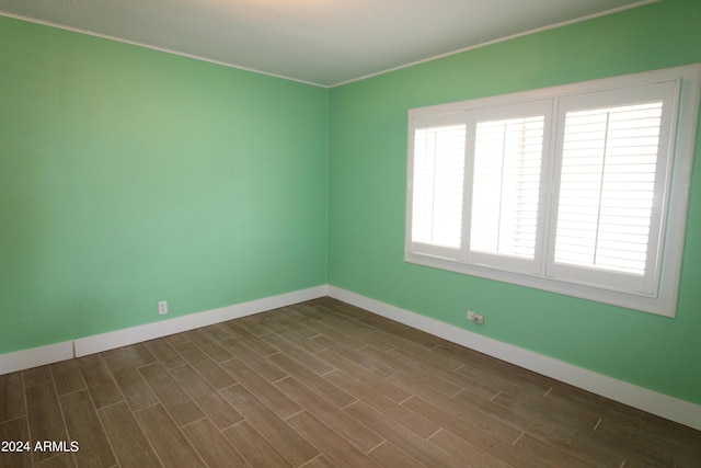 spare room featuring dark hardwood / wood-style floors