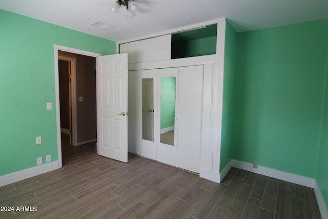 unfurnished bedroom with a closet