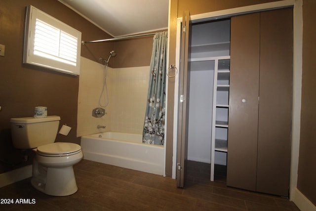 bathroom featuring shower / bath combination with curtain, wood-type flooring, and toilet