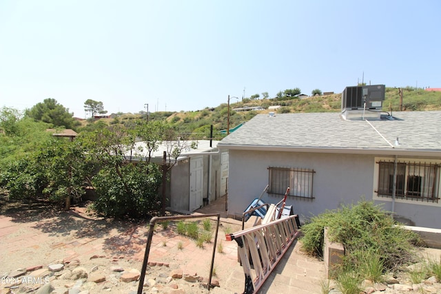 view of home's exterior featuring central AC unit