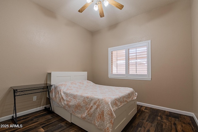 10691 E 37th Pl, Yuma, AZ 85365 - bedroom with dark wood-style flooring, baseboards, and a ceiling fan