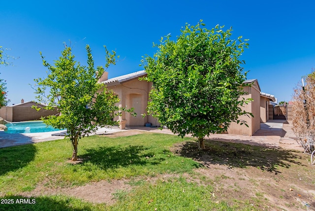 10691 E 37th Pl, Yuma, AZ 85365 - view of front of property with a front lawn, stucco siding, fence, and a tile roof