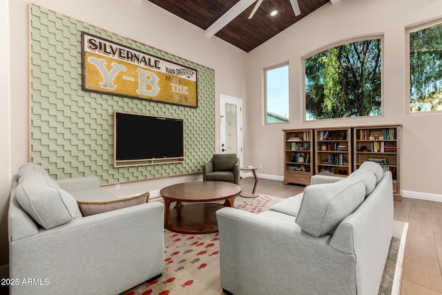 living room with high vaulted ceiling, wooden ceiling, beamed ceiling, and light wood-type flooring