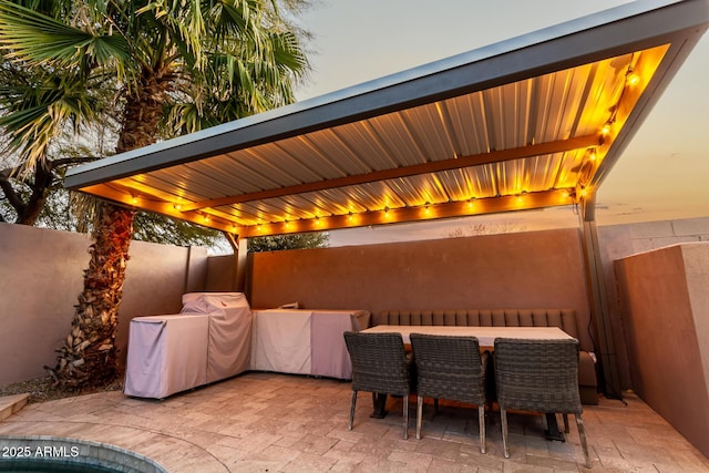 view of patio terrace at dusk