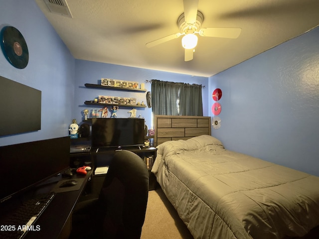 bedroom featuring carpet floors, a ceiling fan, and visible vents