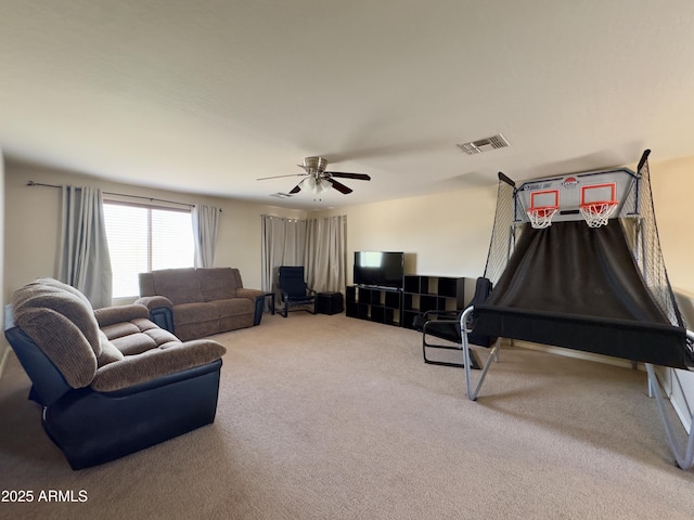 carpeted living room featuring visible vents and a ceiling fan