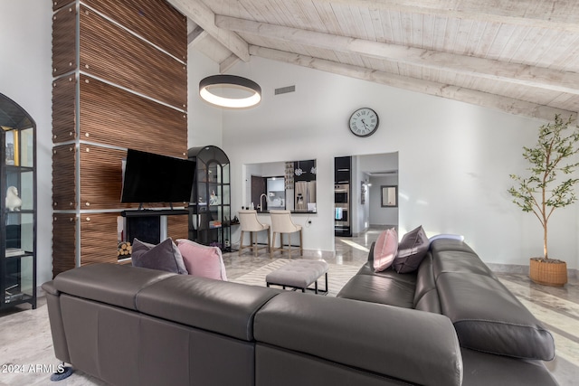 living room featuring high vaulted ceiling, beamed ceiling, and wood ceiling