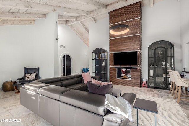 tiled living room with wooden ceiling, beam ceiling, and high vaulted ceiling