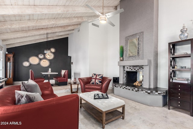 living room with beamed ceiling, a tiled fireplace, ceiling fan, high vaulted ceiling, and wood ceiling