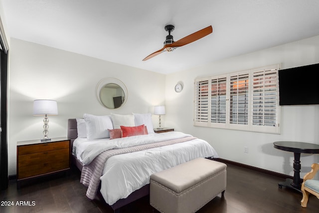 bedroom with ceiling fan and dark hardwood / wood-style floors