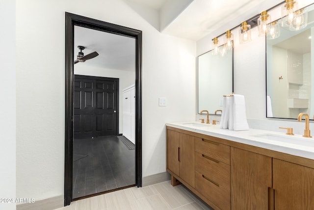 bathroom featuring vanity, hardwood / wood-style flooring, and ceiling fan