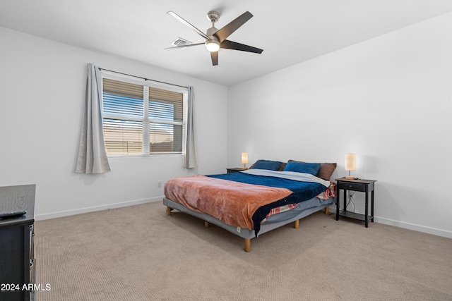 bedroom with light carpet and ceiling fan