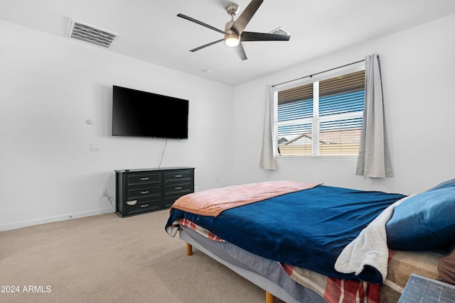 bedroom with light colored carpet and ceiling fan