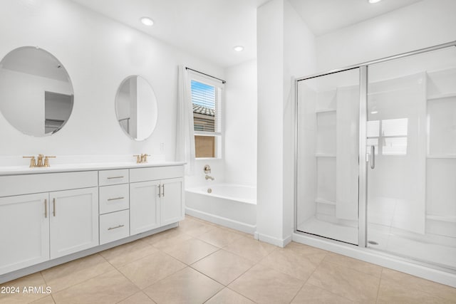 bathroom featuring vanity, tile patterned floors, and separate shower and tub