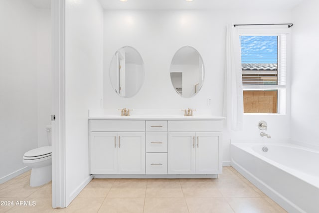 bathroom with vanity, tile patterned floors, a bathtub, and toilet