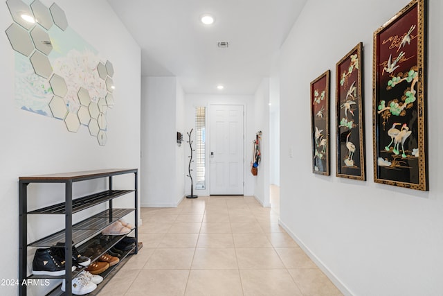 hallway with light tile patterned floors