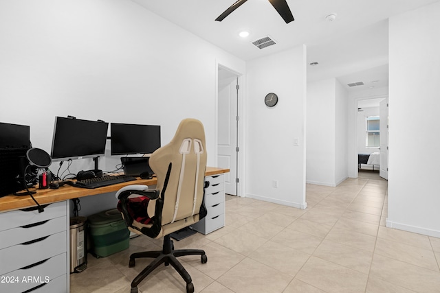 office with ceiling fan and light tile patterned floors