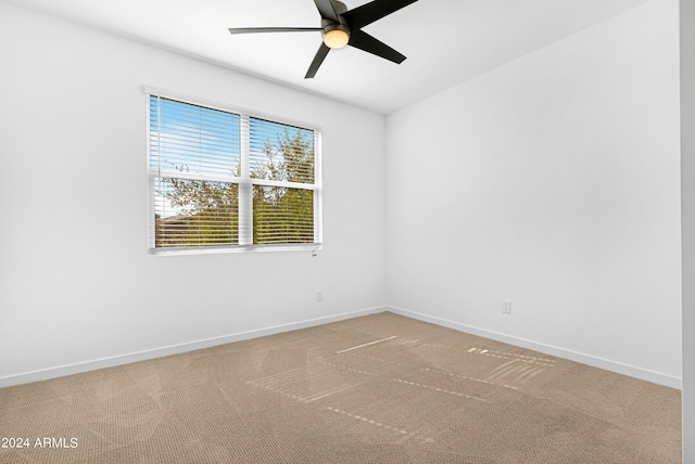 unfurnished room featuring carpet floors and ceiling fan