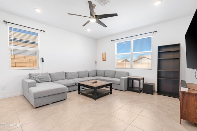 tiled living room featuring ceiling fan