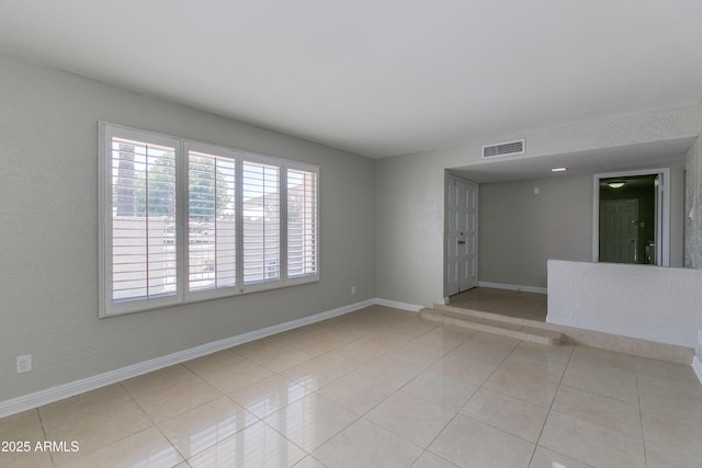 empty room with light tile patterned floors