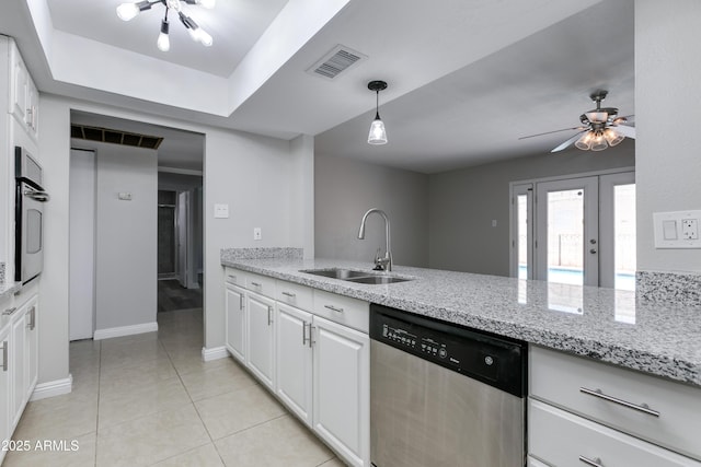 kitchen featuring sink, stainless steel appliances, white cabinets, and light stone countertops