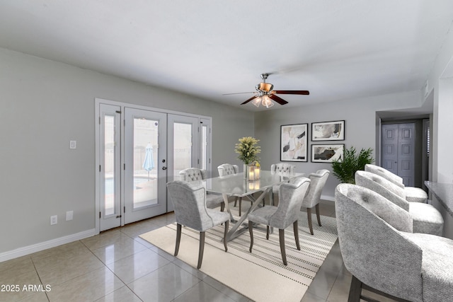 tiled dining area featuring french doors and ceiling fan