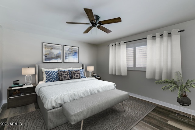 bedroom featuring ceiling fan and dark hardwood / wood-style floors